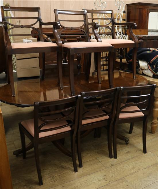 A mahogany twin pillar dining table and six chairs, W.183cm (without leaf)